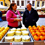 **Image:** A vibrant community farmers market in Krakow's Main Square (Rynek Główny), overflowing with fresh produce. Focus on close-ups of local cheeses, honeys, and traditional Polish baked goods like "obwarzanki". People are smiling, interacting with farmers, and exchanging recipes. In the background, the Cloth Hall (Sukiennice) is visible. The overall atmosphere is bustling and colorful.